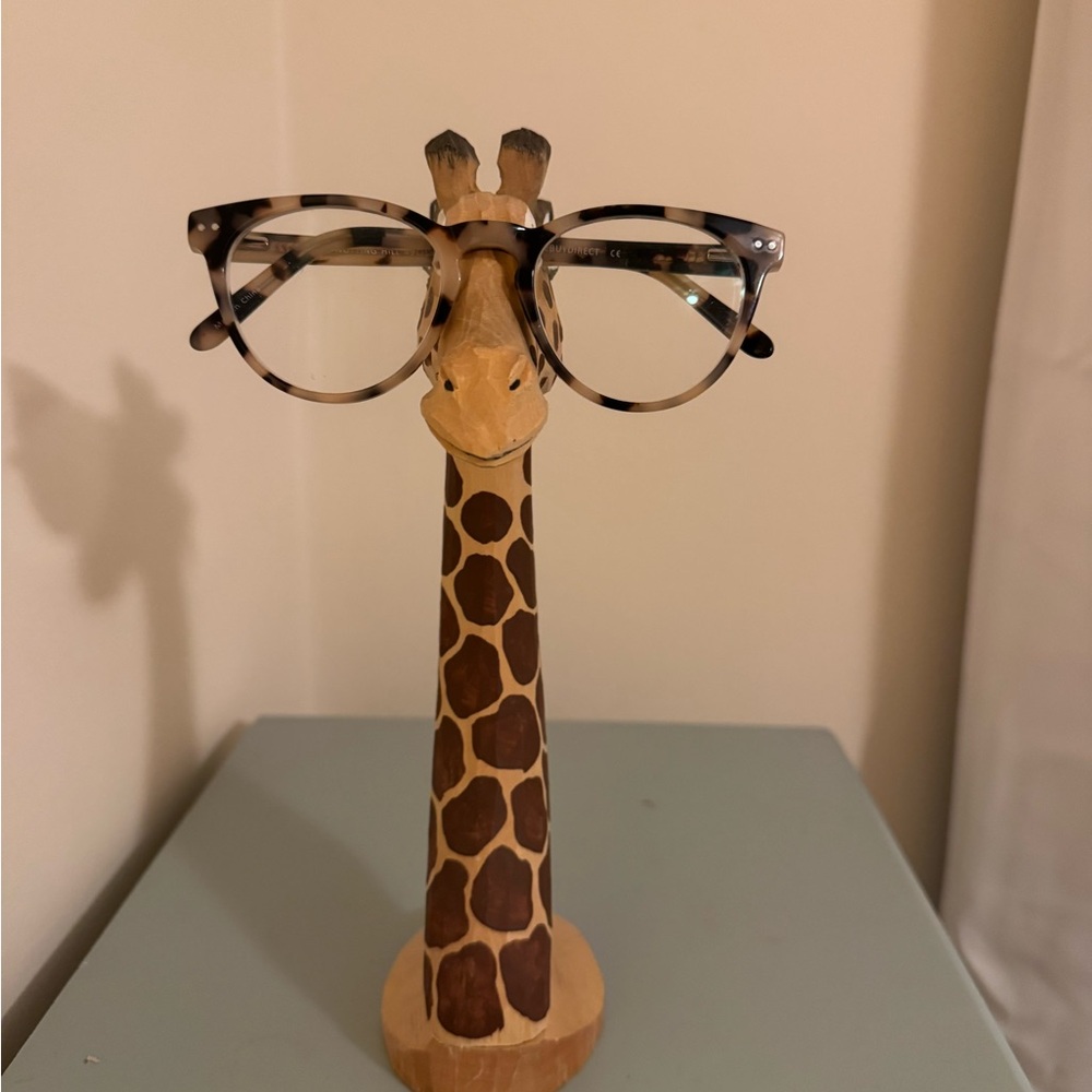 Peepers hand carved and hand painted eye glass holders.  Giraffe